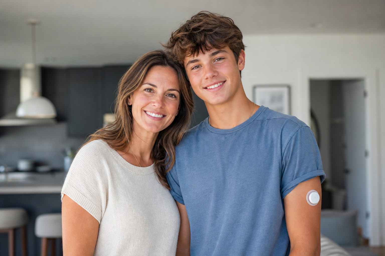 Mom and Teen Son with Diabetes Sensor